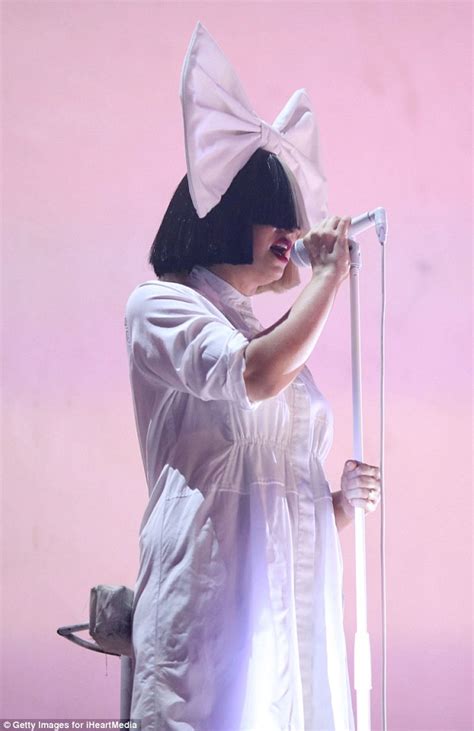 Sia performs in iconic wig onstage at the 2016 iHeartRadio Music Festival | Daily Mail Online