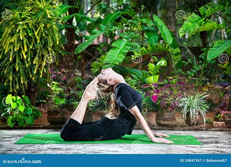 Yoga in the garden stock image. Image of bhujangasana - 24847347