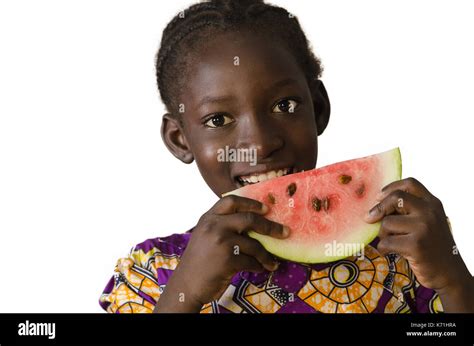 Gorgeous African black child eating some watermelon, isolated on white Stock Photo - Alamy