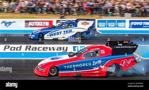 Top Fuel funny car drag racing at Santa Pod Raceway. Kevin Chapman Ford Mustang nearside V Kevin ...