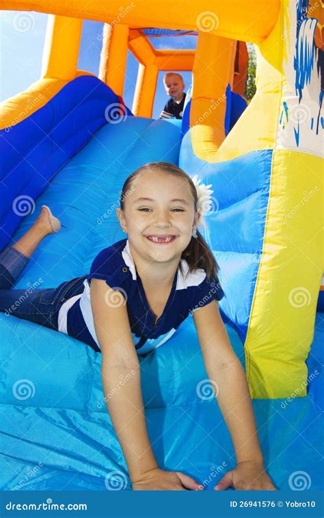 Kids Playing On An Inflatable Slide Bounce House Royalty Free Stock ...