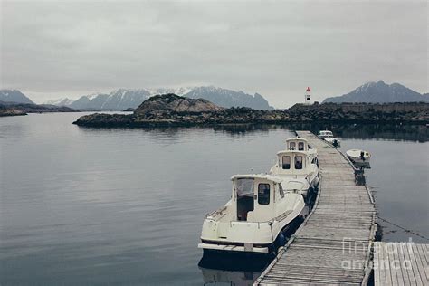 Lighthouse in the wild and remote waters of the Atlantic North S Photograph by Joaquin Corbalan ...