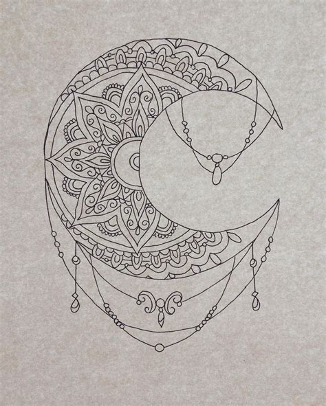 a drawing of a crescent moon with intricate designs on the back and ...