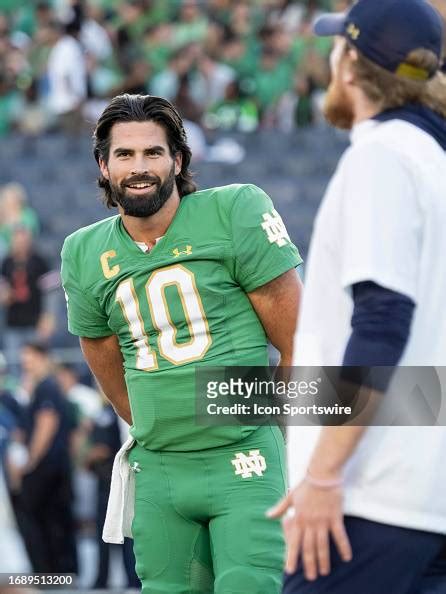 Notre Dame Fighting Irish quarterback Sam Hartman communicates with ...