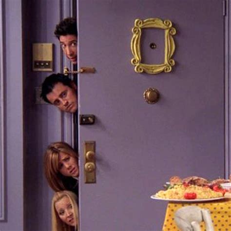 the cast of friends hanging out in front of a purple door with food on it