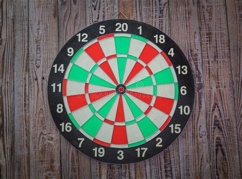 Dartboard on Wood (Darts Hit Target) Stock Photo - Image of dart, darts: 57000086