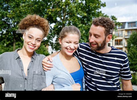 Three happy friends outdoors Stock Photo - Alamy