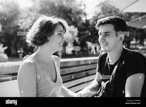 couple sitting in a cafe outside Stock Photo - Alamy