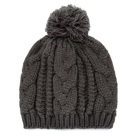 a gray knitted hat with a pom - pom