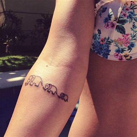 Small Elephants Tattoo On Arm | Tattooshunt.com | Tattoos for daughters, Tiny elephant tattoo ...