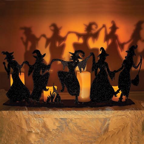 Adorable Dancing Witches Candle Holder cast dramatic shadows onto your wall. Place this ...