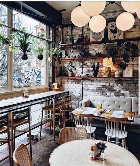 Love the lights the bar in the front window and the hanging plants. | Cafe interior design ...