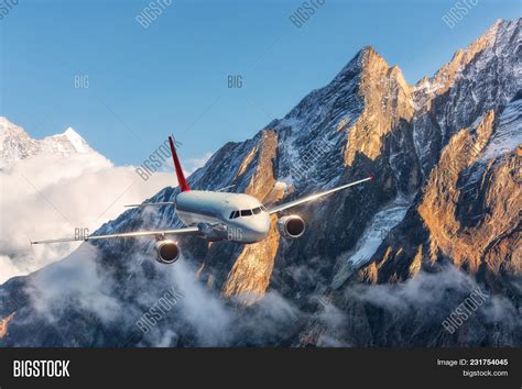 Airplane Flying Over Image & Photo (Free Trial) | Bigstock