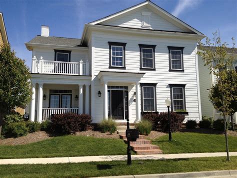 seaside house with lots of windows and dark trim - Google Search | Exterior house paint color ...