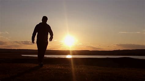 Man Walking On Summer Meadow Sunset Traveler Stock Footage SBV-314362051 - Storyblocks