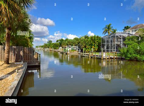 Waterfront homes with boats on canal in Fort Myers beach, Florida Stock ...