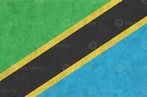 Tanzania flag depicted in bright paint colors on old relief plastering ...