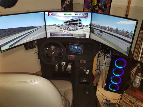 My homemade sim racing cockpit finally finished. Added carpet, upgraded to 3 monitors, soundbar ...