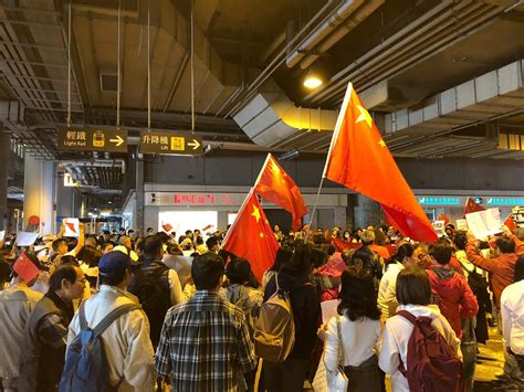 Over a hundred protesters march from main bus terminus at Yuen Long MTR ...