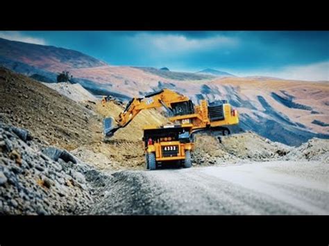 beautiful view of cat 6020 excavator loading cat 777 truck - YouTube