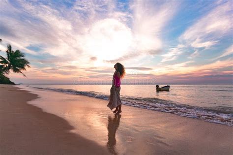 Young Woman Silhouette on the Beach at Sunset Stock Photo - Image of ...