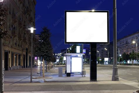 Large horizontal billboard in the night city. Expanse of the night city. Mock-up. Stock Photo ...