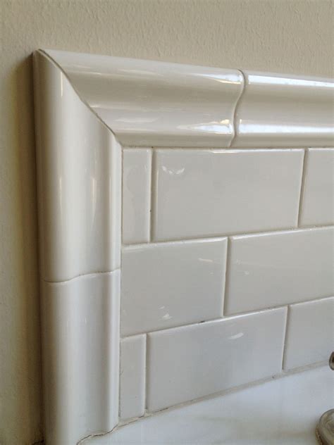 This is my tub surround, three tiles high, but we used a thick trim ...