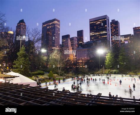 Wollman Rink Ice Skating in Central Park with Manhattan Skyline in background, NYC Stock Photo ...