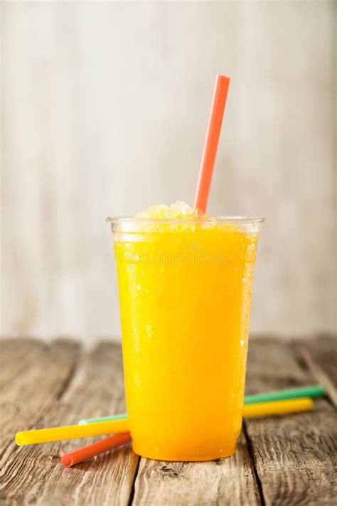 Orange Frozen Slushie in Plastic Cup with Straw Stock Photo - Image of ...