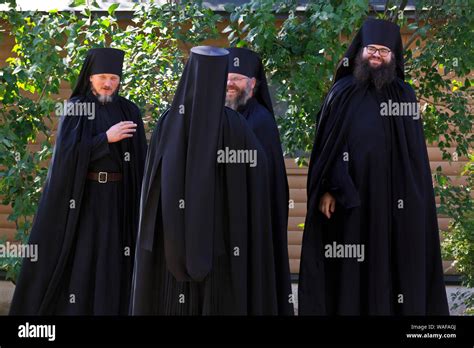 Four Russian Eastern Orthodox monks at the Trinity Lavra of St. Sergius ...