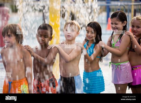 Children playing in water park Stock Photo - Alamy