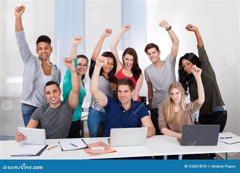 Happy College Students Celebrating Success In Classroom Stock Photo - Image: 53451870