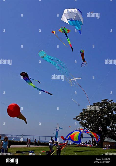 Kites flying on sky Stock Photo - Alamy