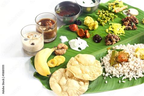 Onam feast on banana leaf isolated on white Stock Photo | Adobe Stock