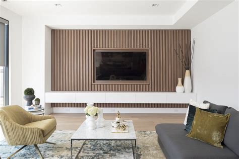 Design Detail - A Wood Slat Accent Wall Surrounds The TV In This Living Room | CONTEMPORIST