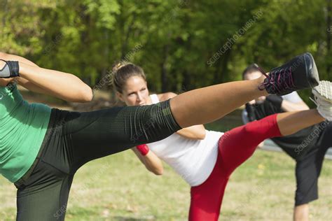 Kickboxing training outdoors - Stock Image - F024/8715 - Science Photo Library