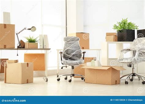 Moving boxes and furniture stock photo. Image of movement - 114513024