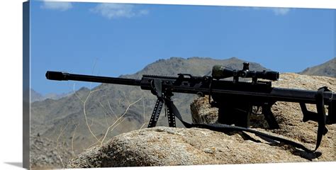 A Barrett .50-caliber M107 Sniper Rifle sits atop an observation point ...