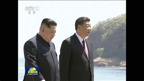 Kim Jong Un strolls along seaside with President Xi Jinping in China ...