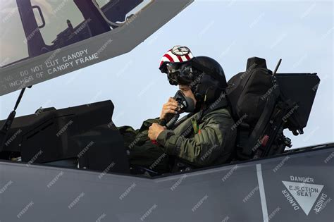 Premium Photo | A fighter pilot in the cockpit of a fighter jet with ...