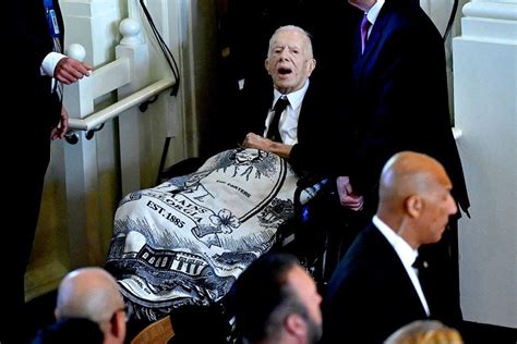 Jimmy Carter Wears Blanket Featuring Image of Rosalynn's Face to Her Memorial Service