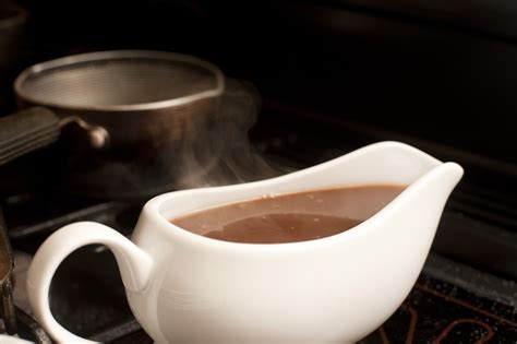 Gravy boat filled with delicious rich gravy - Free Stock Image