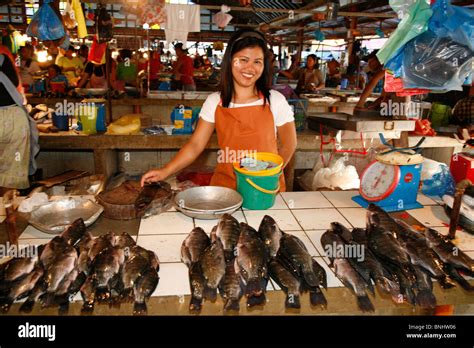 Philippines Asia Luzon island fish market Batangas vendor fish sale selling stand stall seafood ...