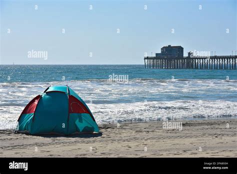 Scenic seascape with panoramic view of a beach camping tent overlooking ...