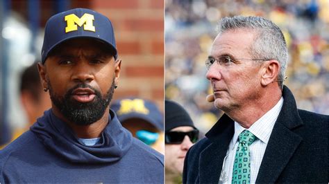 Charles Woodson and Urban Meyer adjacently reacting to game-winning INT ...