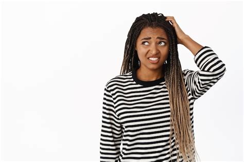 Free Photo | Portrait of confused black girl looking awkward and unsure scratching head and ...