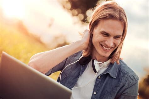 Premium Photo | Young man using laptop outdoors