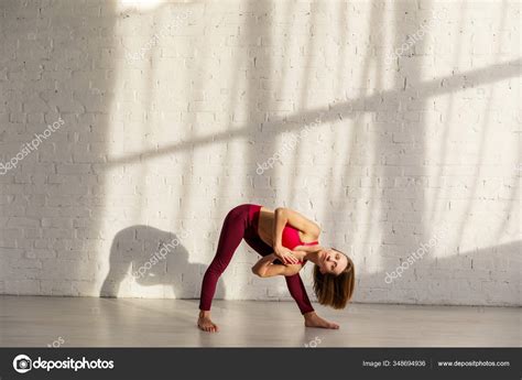 Sportive Woman Barefoot Doing Yoga Exercise Brick Wall Stock Photo by ...