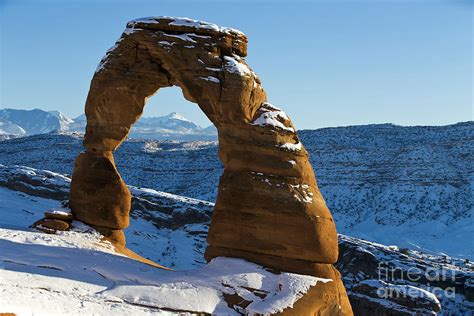 Delicate Arch With Snow Arches National Park Utah Photograph by Jason O Watson