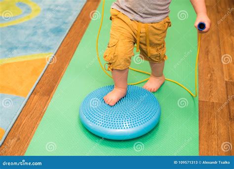 Little Kid Massages His Feet while Standing on the Rug Stock Image - Image of indoor, care ...